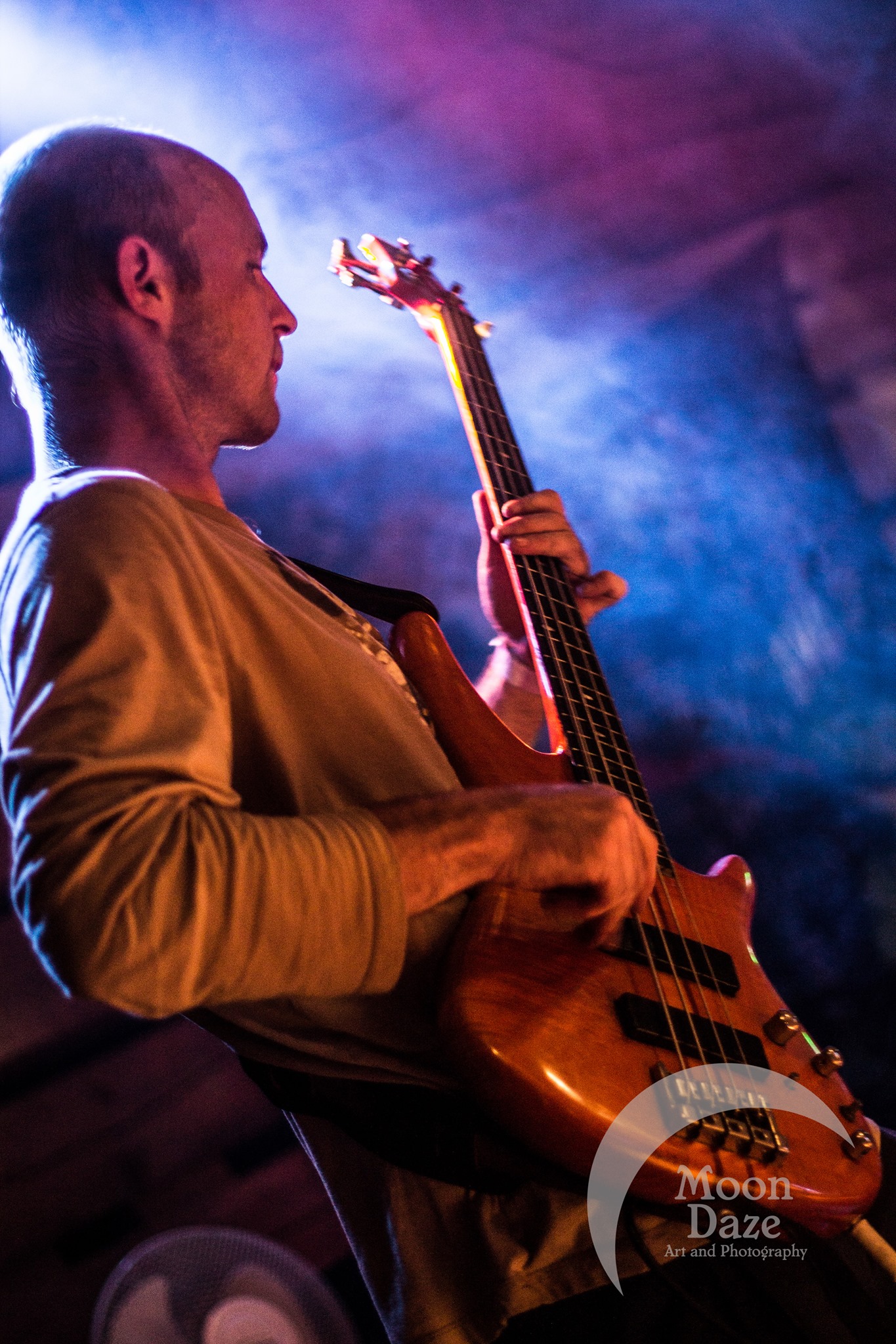 Greg Goad playing the bass on stage